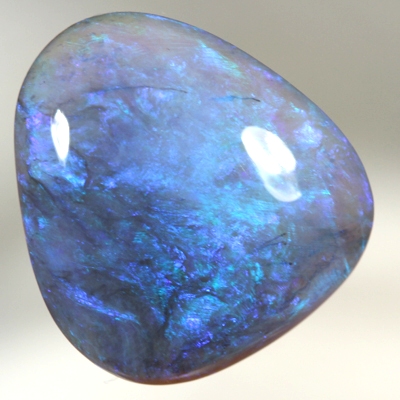 SOLID BLACK CRYSTAL OPAL Lustrous colours of gold green turquoise to blue and purple
